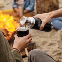 Klean Kanteen Insulated TK Pro (1000ml) Black -Cheap Cook N Camp Store tkpro square pouring lifestyle 9b62390e 849a 4925 adcd 61b6e9f07bce